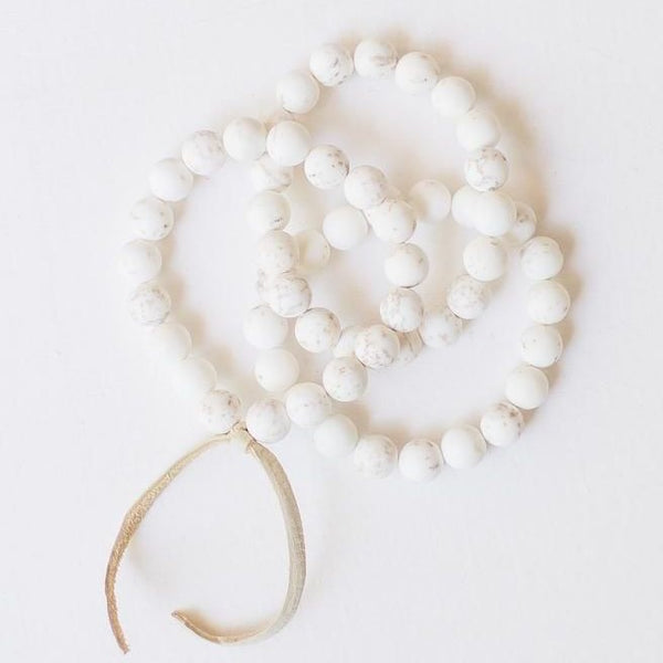 white beaded bracelet set