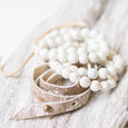 white beaded bracelet set